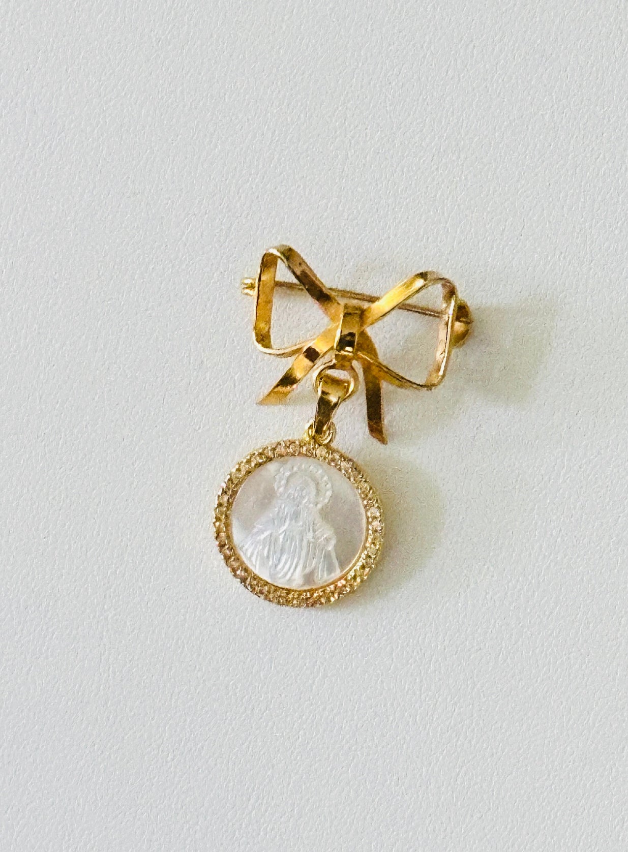 Golden Bow Shaped Baby Pin with Miraculous Virgin Mary Medal