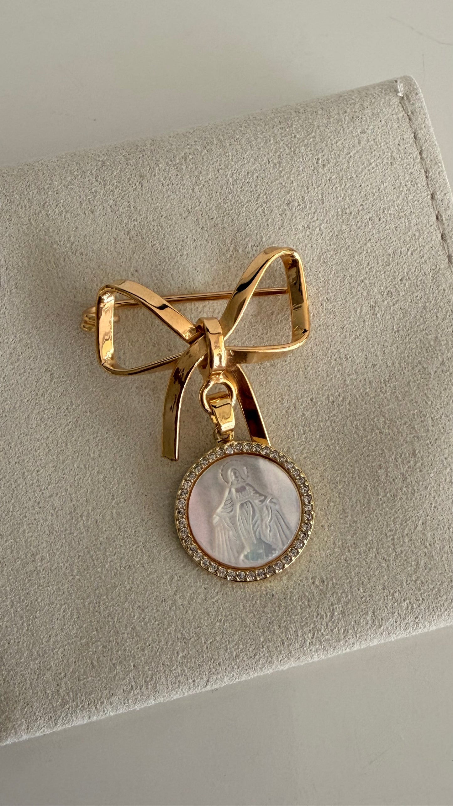 Golden Bow Shaped Baby Pin with Miraculous Virgin Mary Medal